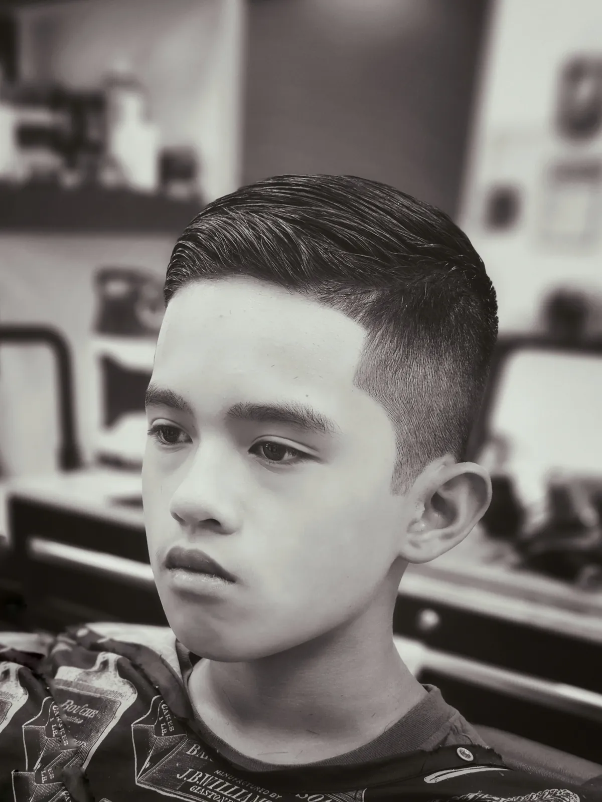 Boys' high fade comb-over with crisp line-up at Willow Road Barber Shop in Guelph