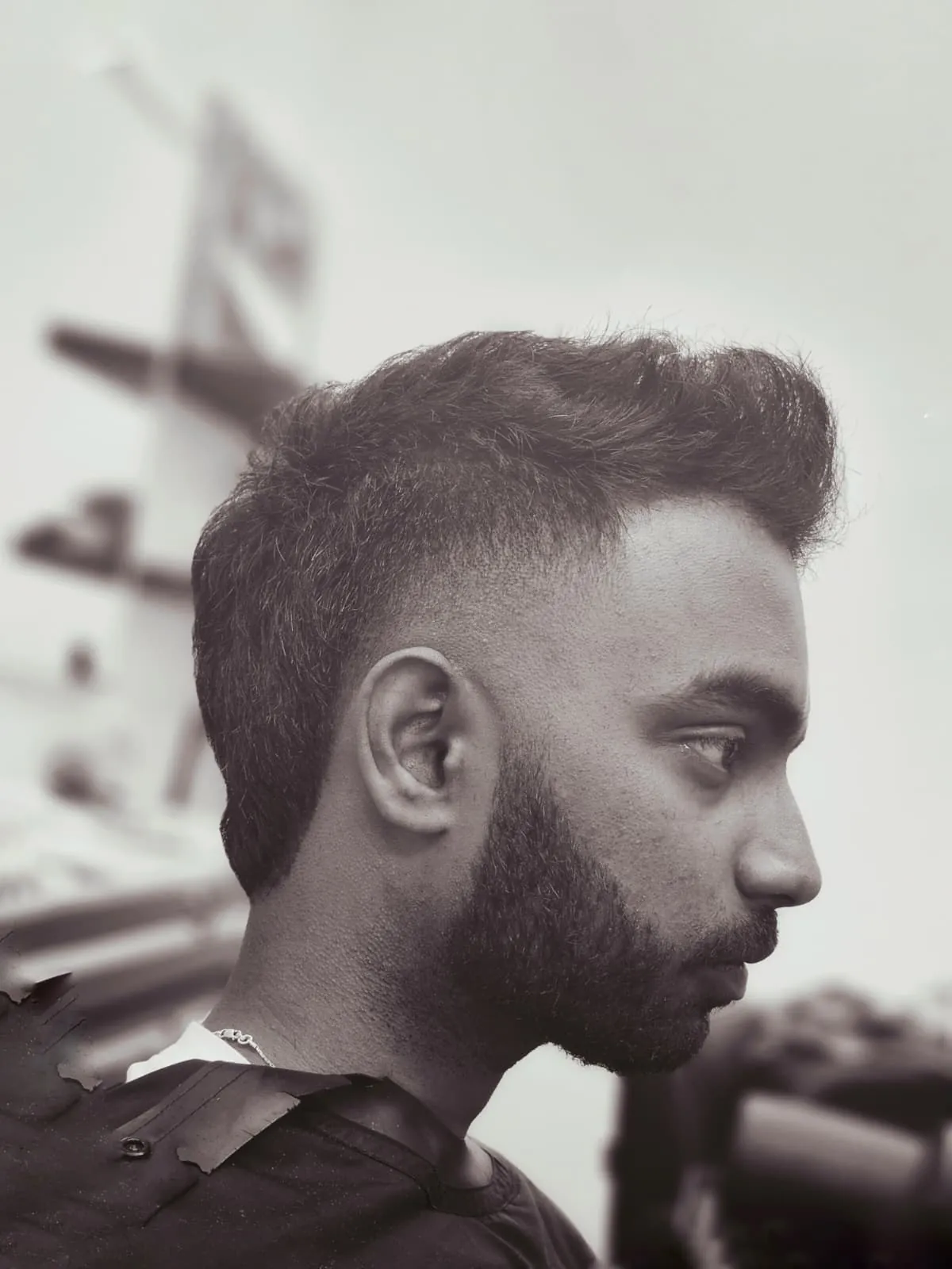 Men's low fade with textured quiff and beard at Willow Road Barber Shop in Guelph