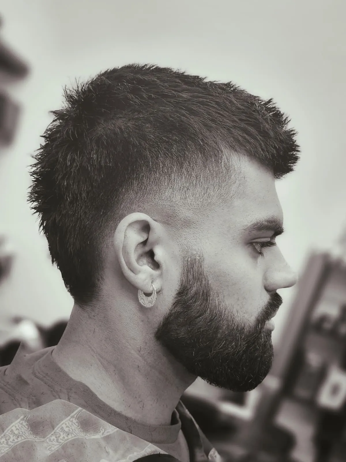 Men's mid skin fade with textured crop and faded full beard at Willow Road Barber Shop in Guelph