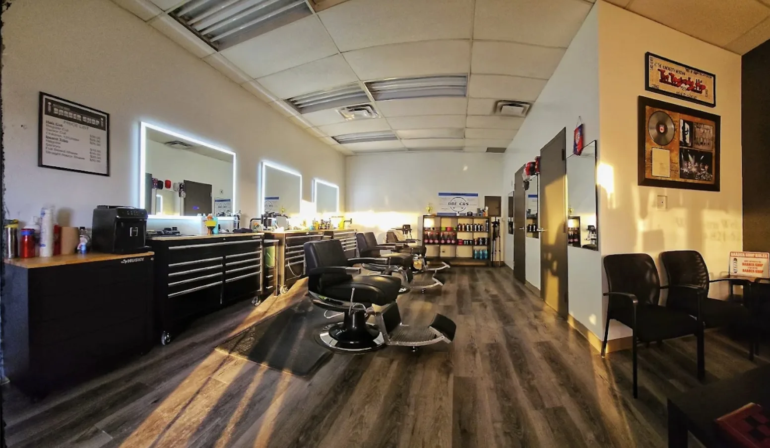 Inside Willow Road Barber Shop in Guelph — barber at the chair, classic neighbourhood setting